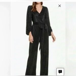 Eliza J. Long Sleeve Open Back Metallic
Black Jumpsuit